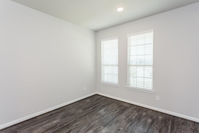 8506 Belfast Manor Ln, Richmond, TX 77407 - empty room with dark wood-style floors and recessed lighting