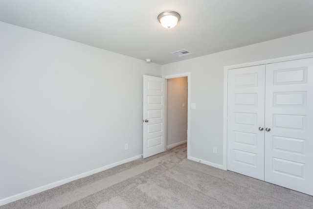 8506 Belfast Manor Ln, Richmond, TX 77407 - unfurnished bedroom featuring light carpet and a closet