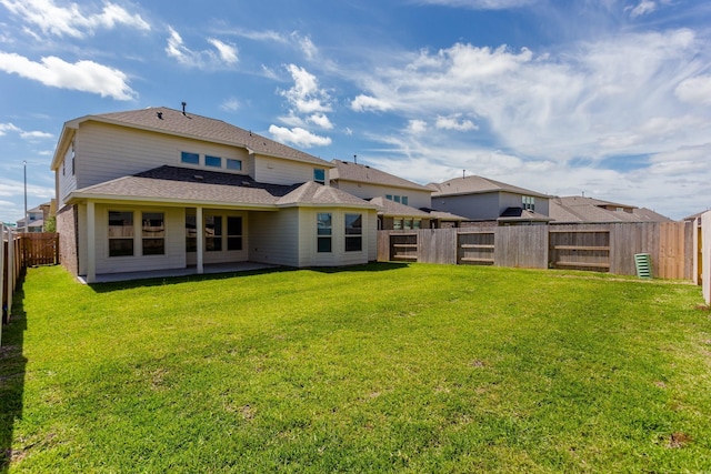 8506 Belfast Manor Ln, Richmond, TX 77407 - rear view of property featuring a fenced backyard, a patio, and a shingled roof