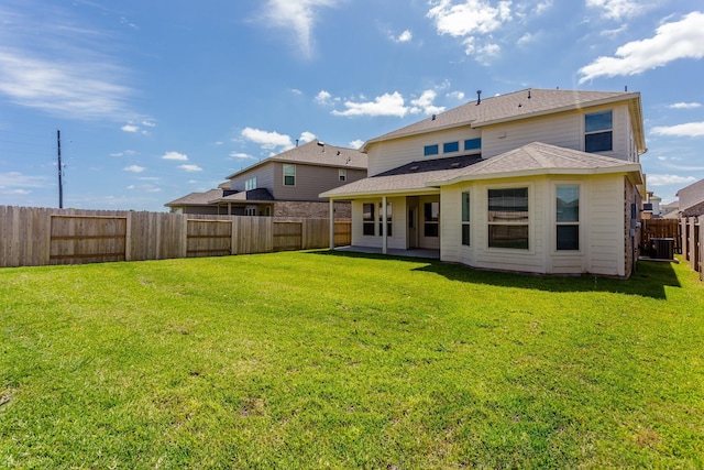8506 Belfast Manor Ln, Richmond, TX 77407 - rear view of property featuring a fenced backyard, a patio area, and a shingled roof