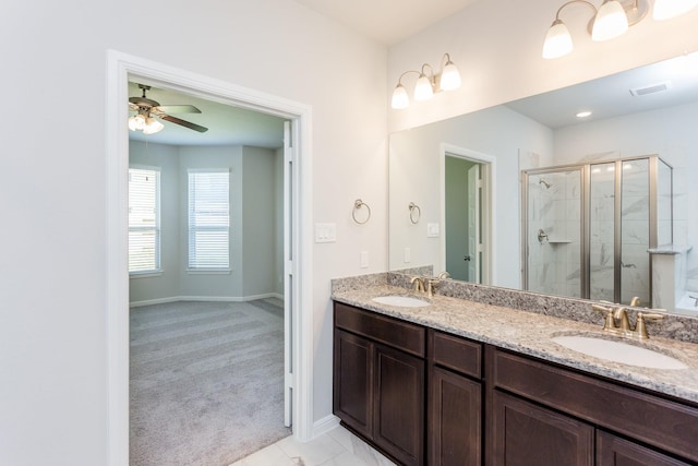 8506 Belfast Manor Ln, Richmond, TX 77407 - bathroom featuring a stall shower, double vanity, and a ceiling fan