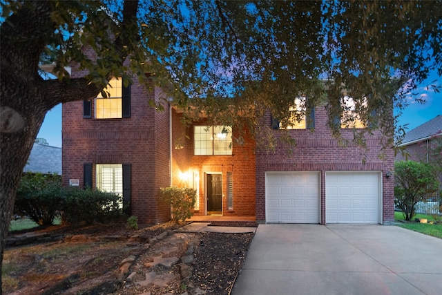 8014 Sports Haven Dr, Humble, TX 77346 - traditional-style house with concrete driveway, an attached garage, and brick siding