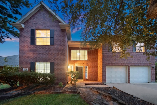 8014 Sports Haven Dr, Humble, TX 77346 - traditional-style home with brick siding, concrete driveway, and an attached garage