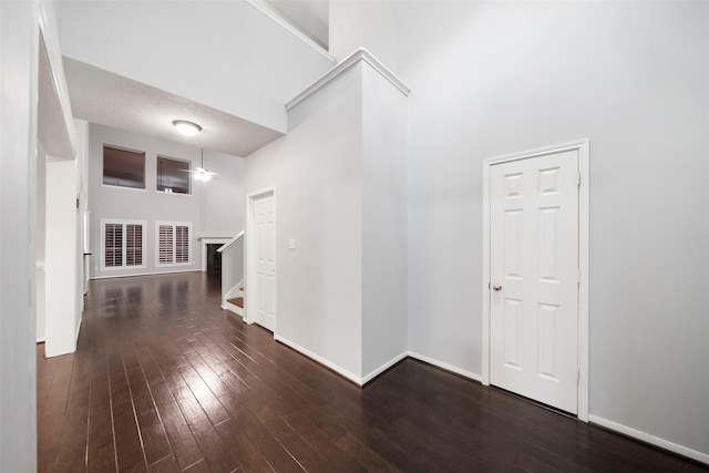 8014 Sports Haven Dr, Humble, TX 77346 - hall with wood-type flooring, a high ceiling, and stairs