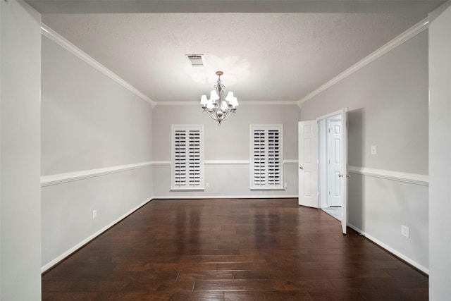 8014 Sports Haven Dr, Humble, TX 77346 - unfurnished dining area with a chandelier, hardwood / wood-style flooring, ornamental molding, and a textured ceiling