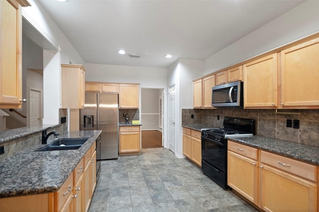 8014 Sports Haven Dr, Humble, TX 77346 - kitchen with stainless steel appliances, light brown cabinetry, tasteful backsplash, dark stone countertops, and recessed lighting