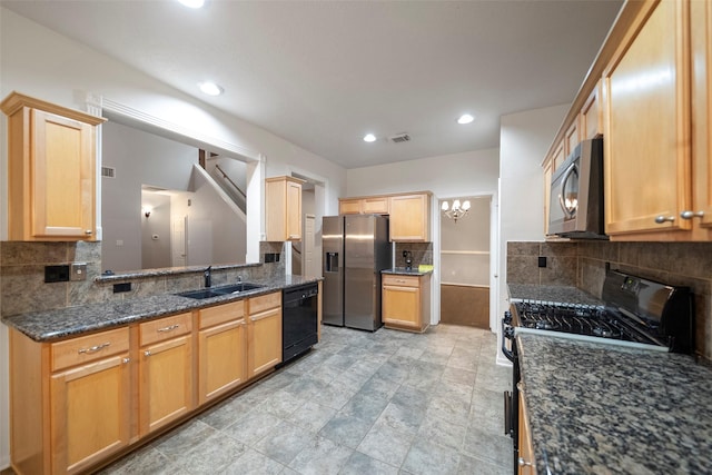8014 Sports Haven Dr, Humble, TX 77346 - kitchen with black appliances, tasteful backsplash, light brown cabinetry, dark stone counters, and recessed lighting