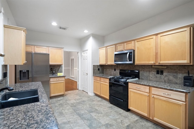 8014 Sports Haven Dr, Humble, TX 77346 - kitchen featuring stainless steel appliances, tasteful backsplash, light brown cabinetry, and recessed lighting