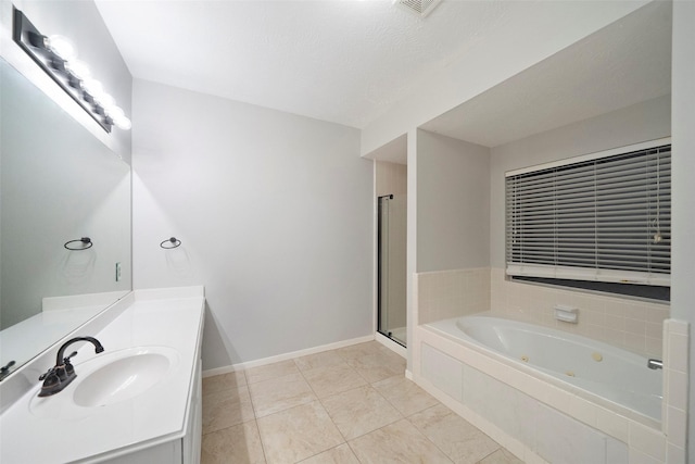 8014 Sports Haven Dr, Humble, TX 77346 - bathroom with a tub with jets, vanity, tile patterned flooring, and a stall shower