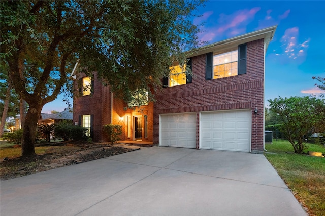 8014 Sports Haven Dr, Humble, TX 77346 - view of front of property featuring brick siding, concrete driveway, and an attached garage