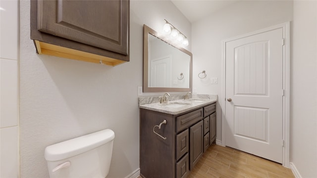 225 Sycamore, Lumberton, TX 77657 - bathroom featuring double vanity and wood finished floors