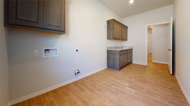 225 Sycamore, Lumberton, TX 77657 - washroom with electric dryer hookup, hookup for a washing machine, cabinet space, light wood finished floors, and recessed lighting