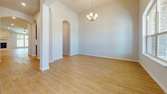225 Sycamore, Lumberton, TX 77657 - unfurnished room featuring a ceiling fan, light wood-style floors, arched walkways, a chandelier, and recessed lighting