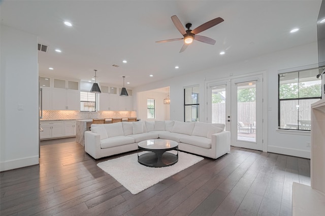 6525 Wharton St, Houston, TX 77055 - living area featuring a ceiling fan, dark wood-style floors, recessed lighting, and french doors
