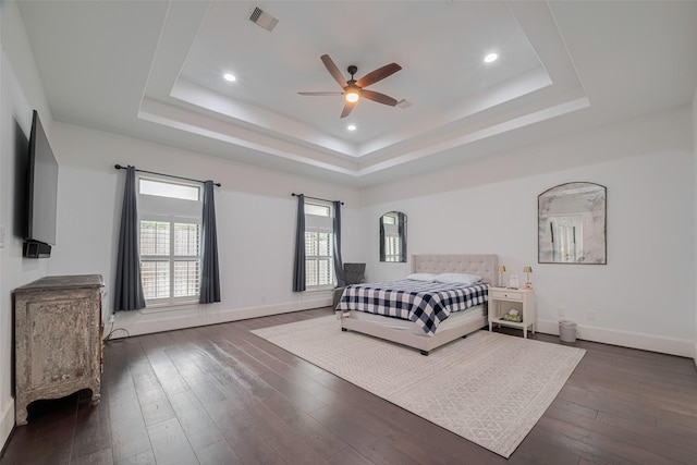 6525 Wharton St, Houston, TX 77055 - bedroom featuring a raised ceiling, dark wood-style flooring, recessed lighting, and ceiling fan