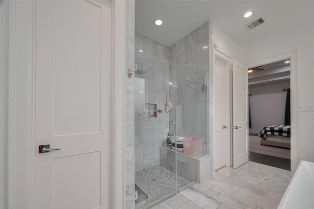 6525 Wharton St, Houston, TX 77055 - full bathroom featuring connected bathroom, marble finish flooring, a stall shower, and recessed lighting