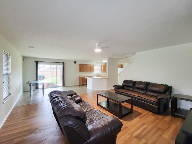 18403 Fair Grange Ln, Cypress, TX 77433 - living area with light wood-style flooring and ceiling fan