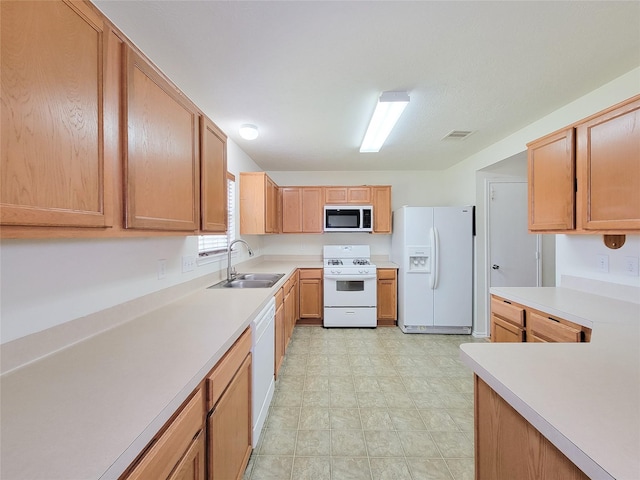 18403 Fair Grange Ln, Cypress, TX 77433 - kitchen featuring white appliances, light countertops, and light flooring