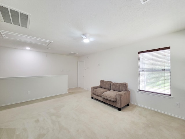18403 Fair Grange Ln, Cypress, TX 77433 - living area featuring attic access, light colored carpet, and a textured ceiling