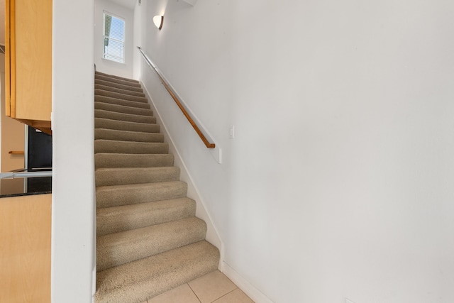 7615 Brae Acres Ct, Houston, TX 77074 - stairway featuring tile patterned flooring and baseboards