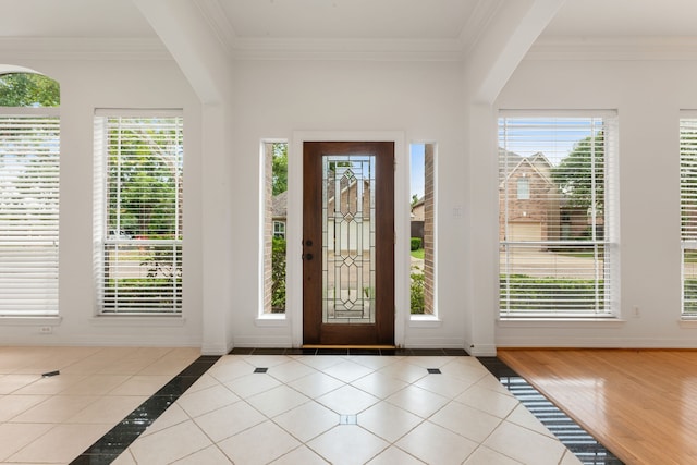 7615 Brae Acres Ct, Houston, TX 77074 - entrance foyer with crown molding, plenty of natural light, and tile patterned floors