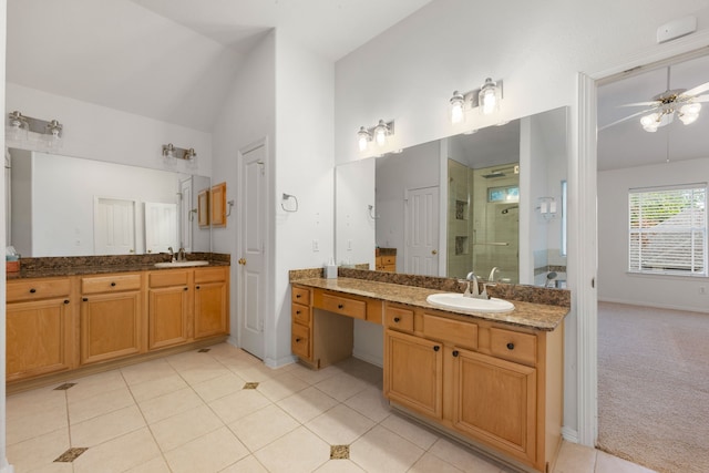 7615 Brae Acres Ct, Houston, TX 77074 - full bathroom featuring a ceiling fan, a stall shower, two vanities, lofted ceiling, and tile patterned flooring