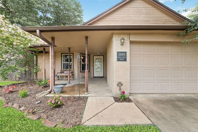 3060 High Plains Dr, Katy, TX 77449 - view of front of property with covered porch, brick siding, an attached garage, and concrete driveway