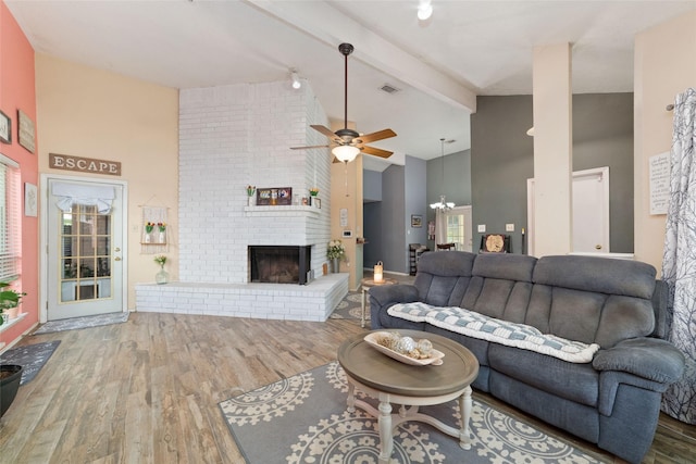 3060 High Plains Dr, Katy, TX 77449 - living area with high vaulted ceiling, wood finished floors, a ceiling fan, beamed ceiling, and a fireplace