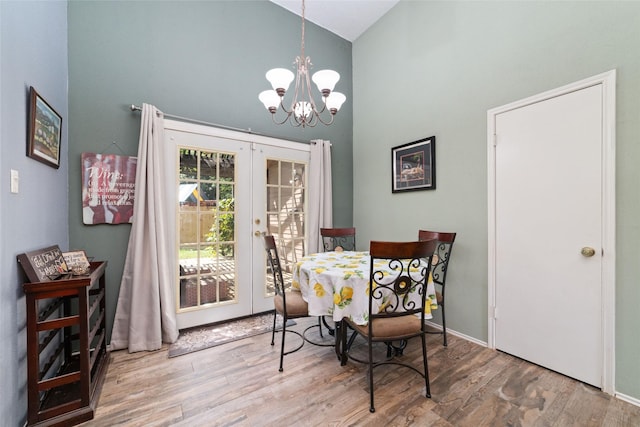 3060 High Plains Dr, Katy, TX 77449 - dining area featuring high vaulted ceiling, a chandelier, french doors, and wood finished floors