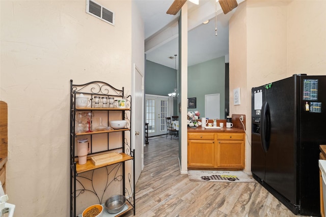 3060 High Plains Dr, Katy, TX 77449 - kitchen with black refrigerator with ice dispenser, high vaulted ceiling, light wood-type flooring, a ceiling fan, and french doors