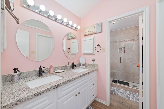 3060 High Plains Dr, Katy, TX 77449 - full bathroom featuring a shower stall, double vanity, lofted ceiling, and wood finished floors