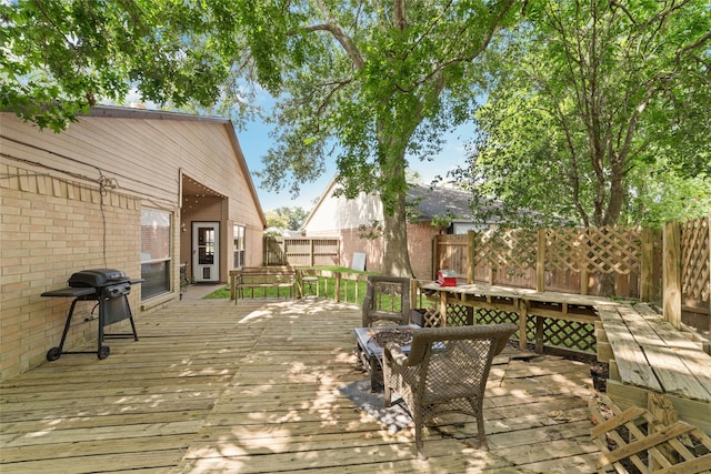 3060 High Plains Dr, Katy, TX 77449 - wooden deck with outdoor dining space, area for grilling, and a fenced backyard