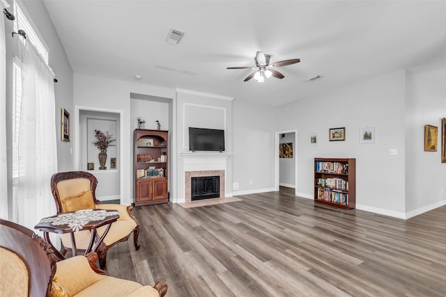 3731 Crescent Dr, Pearland, TX 77584 - living area featuring a ceiling fan, wood finished floors, and a tile fireplace