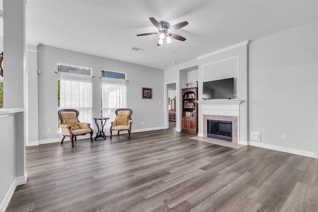 3731 Crescent Dr, Pearland, TX 77584 - living room with ceiling fan, built in shelves, a fireplace, and wood finished floors