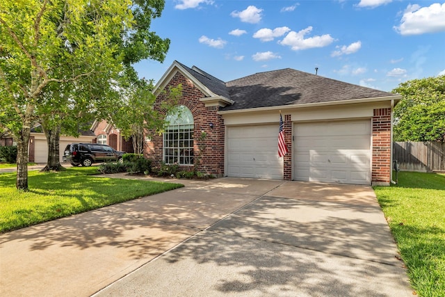 3731 Crescent Dr, Pearland, TX 77584 - view of front facade featuring brick siding, an attached garage, driveway, and roof with shingles