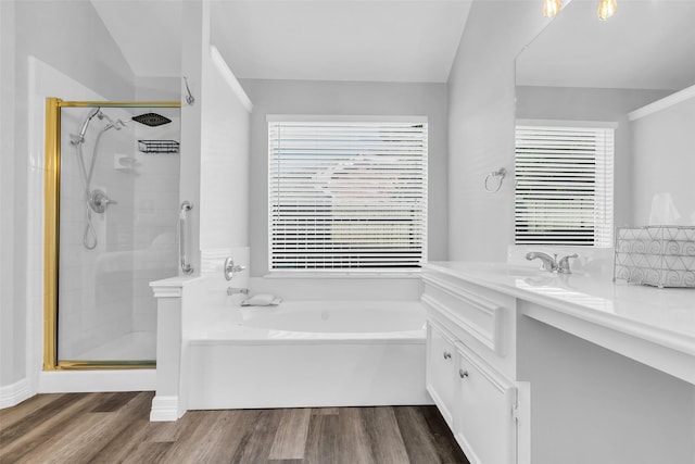 3731 Crescent Dr, Pearland, TX 77584 - full bath with a bath, a stall shower, plenty of natural light, and wood finished floors