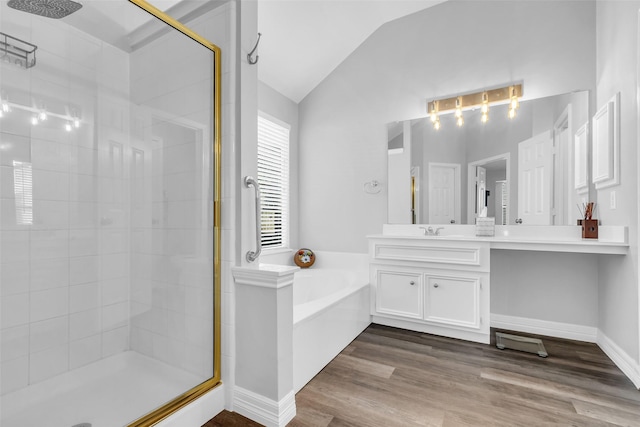 3731 Crescent Dr, Pearland, TX 77584 - full bathroom featuring a stall shower, a garden tub, lofted ceiling, vanity, and wood finished floors