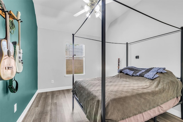 3731 Crescent Dr, Pearland, TX 77584 - bedroom featuring wood finished floors, vaulted ceiling, and a ceiling fan