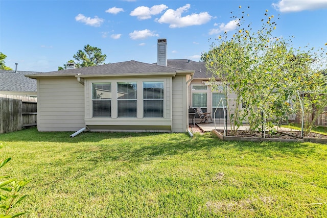 3731 Crescent Dr, Pearland, TX 77584 - rear view of house with a chimney, a patio, and a vegetable garden