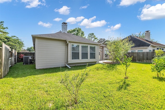 3731 Crescent Dr, Pearland, TX 77584 - rear view of house featuring a fenced backyard and a chimney