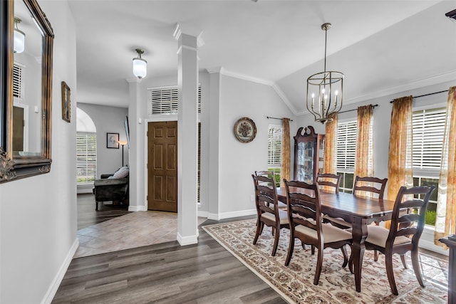 3731 Crescent Dr, Pearland, TX 77584 - dining area with crown molding, vaulted ceiling, a chandelier, and dark wood finished floors