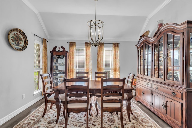 3731 Crescent Dr, Pearland, TX 77584 - dining area with vaulted ceiling, dark wood-style flooring, a chandelier, and ornamental molding