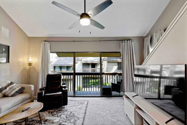 12900 Walden Rd Unit 706G, Montgomery, TX 77356 - living room with carpet flooring, a ceiling fan, a textured ceiling, and lofted ceiling