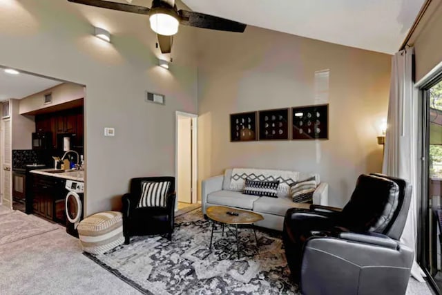 12900 Walden Rd Unit 706G, Montgomery, TX 77356 - living area with washer / clothes dryer, ceiling fan, and carpet floors
