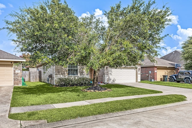 15110 Sierra Ridge Dr, Humble, TX 77396 - view of front facade with driveway, a garage, and brick siding