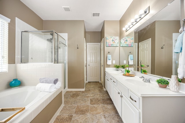 15110 Sierra Ridge Dr, Humble, TX 77396 - bathroom with double vanity, a shower stall, a bath, and plenty of natural light