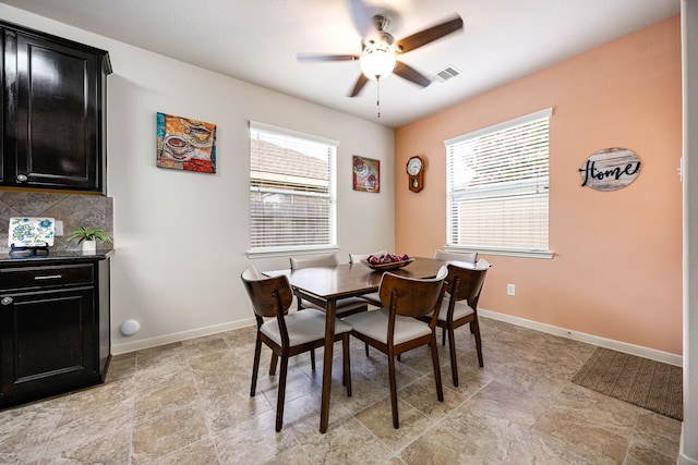 15110 Sierra Ridge Dr, Humble, TX 77396 - dining room with healthy amount of natural light, ceiling fan, and light stone finish flooring