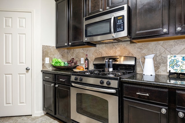 15110 Sierra Ridge Dr, Humble, TX 77396 - kitchen with stainless steel appliances, dark stone countertops, decorative backsplash, and dark brown cabinetry