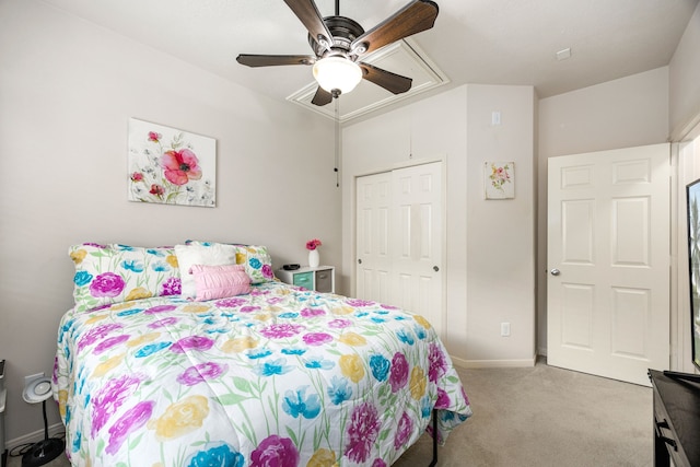 15110 Sierra Ridge Dr, Humble, TX 77396 - bedroom with attic access, light carpet, a ceiling fan, and a closet