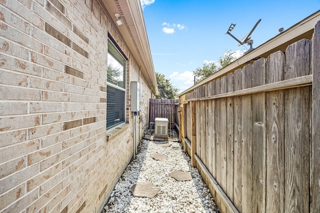 15110 Sierra Ridge Dr, Humble, TX 77396 - view of side of home with a central AC unit